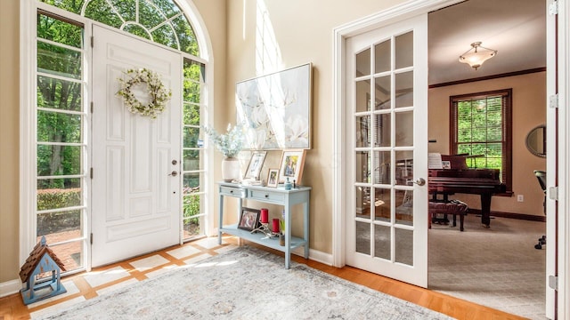 108 Hawks Cove Ct, Granville, OH 43023 - entryway with wood finished floors and ornamental molding