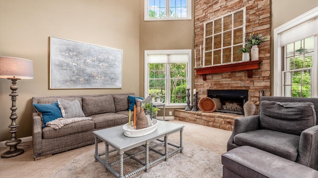108 Hawks Cove Ct, Granville, OH 43023 - living room with a stone fireplace, carpet floors, and a towering ceiling
