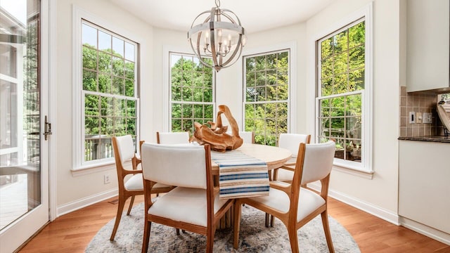108 Hawks Cove Ct, Granville, OH 43023 - dining room featuring plenty of natural light, a chandelier, and light wood-type flooring