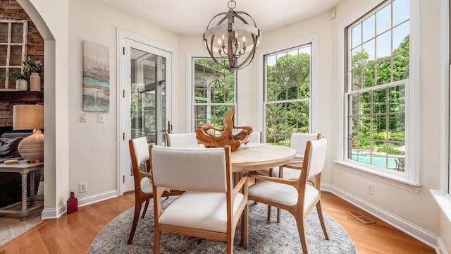 108 Hawks Cove Ct, Granville, OH 43023 - dining room featuring plenty of natural light, a chandelier, and light wood finished floors