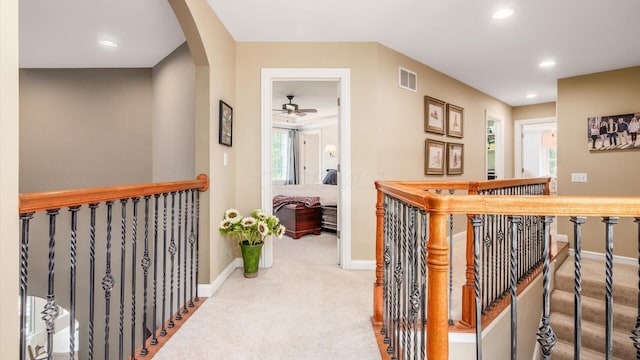 108 Hawks Cove Ct, Granville, OH 43023 - corridor with carpet floors, an upstairs landing, recessed lighting, and arched walkways