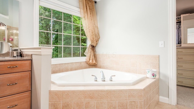 108 Hawks Cove Ct, Granville, OH 43023 - full bath featuring vanity, a garden tub, plenty of natural light, and a spacious closet