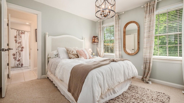 108 Hawks Cove Ct, Granville, OH 43023 - bedroom with a chandelier and carpet floors