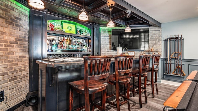 108 Hawks Cove Ct, Granville, OH 43023 - indoor wet bar with wood finished floors and brick wall