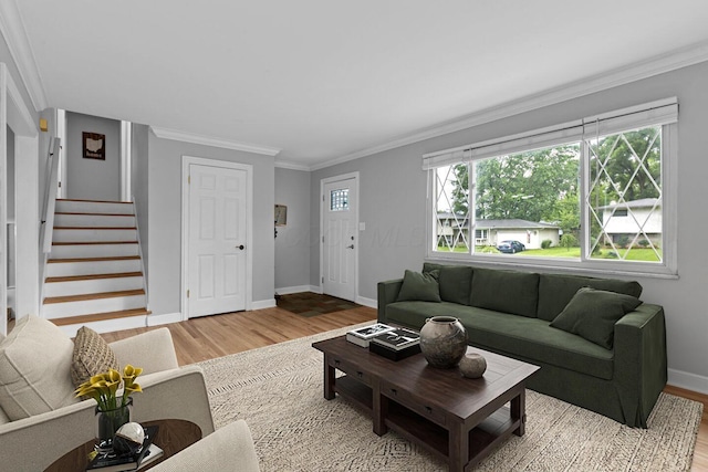966 Larkstone Dr, Columbus, OH 43235 - living room with wood finished floors, stairs, and ornamental molding