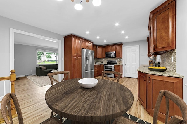 966 Larkstone Dr, Columbus, OH 43235 - dining space featuring light wood finished floors and recessed lighting
