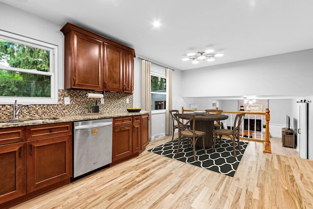966 Larkstone Dr, Columbus, OH 43235 - kitchen featuring stainless steel dishwasher, light wood-type flooring, decorative backsplash, and light stone countertops