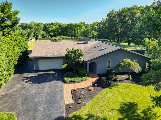 2500 Carriage Rd, Powell, OH 43065 - view of front facade with a garage and asphalt driveway