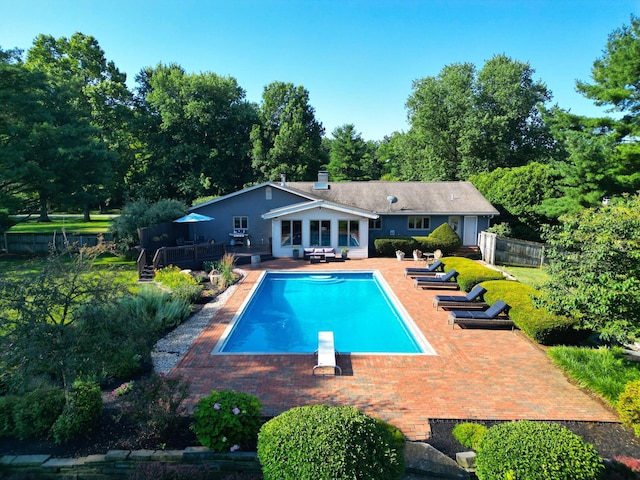 2500 Carriage Rd, Powell, OH 43065 - outdoor pool featuring a diving board, a patio, and a wooden deck