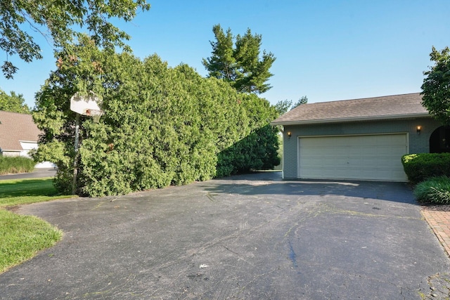 2500 Carriage Rd, Powell, OH 43065 - garage with asphalt driveway