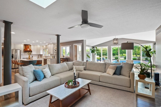 2500 Carriage Rd, Powell, OH 43065 - living area featuring recessed lighting, light wood-style flooring, ceiling fan, lofted ceiling, and a textured ceiling
