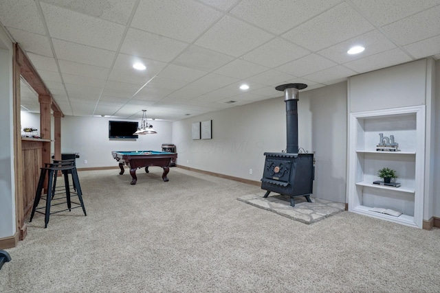 2500 Carriage Rd, Powell, OH 43065 - recreation room featuring carpet flooring, a wood stove, billiards, recessed lighting, and built in shelves