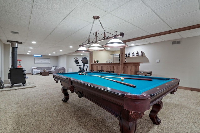 2500 Carriage Rd, Powell, OH 43065 - recreation room featuring carpet floors, a wood stove, a drop ceiling, billiards, and bar
