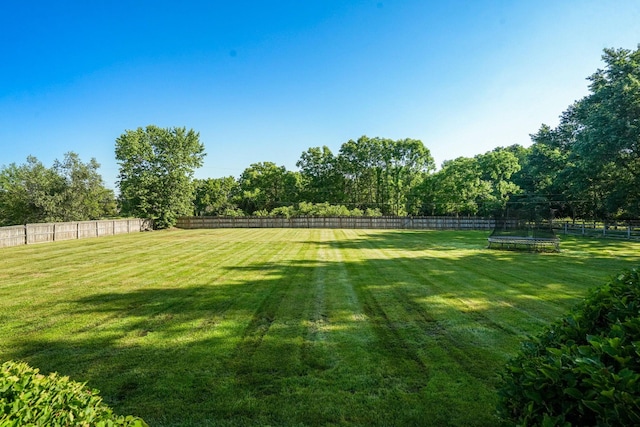 2500 Carriage Rd, Powell, OH 43065 - fenced backyard featuring a trampoline