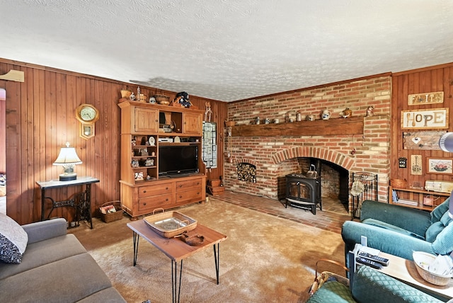 1994 County Road 61, Edison, OH 43320 - living room featuring wooden walls, a wood stove, light colored carpet, and a textured ceiling