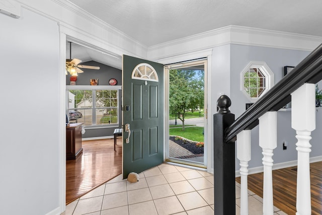 1271 Fareharm Dr, New Albany, OH 43054 - entryway with plenty of natural light, crown molding, light tile patterned flooring, lofted ceiling, and a ceiling fan