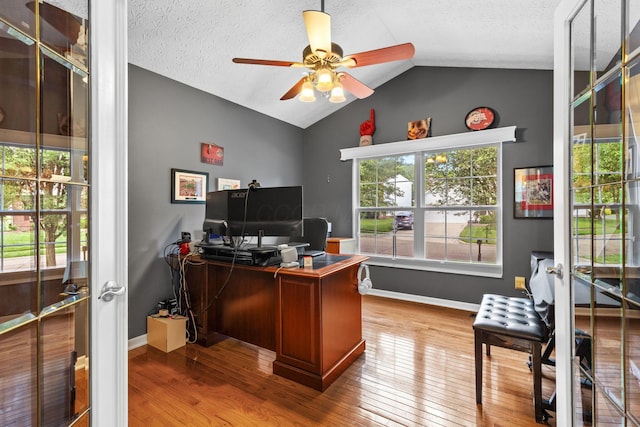 1271 Fareharm Dr, New Albany, OH 43054 - office with vaulted ceiling, wood finished floors, french doors, a ceiling fan, and a textured ceiling