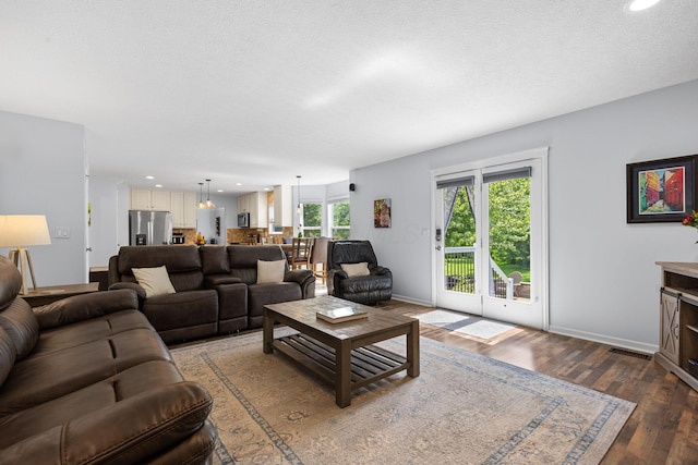 1271 Fareharm Dr, New Albany, OH 43054 - living area with wood finished floors, recessed lighting, and a textured ceiling