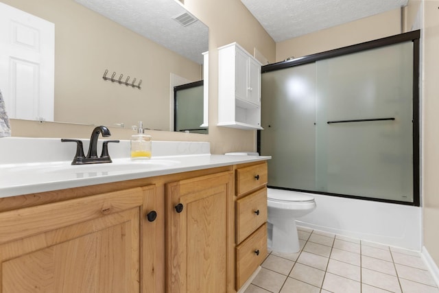 1271 Fareharm Dr, New Albany, OH 43054 - bathroom featuring vanity, tile patterned floors, shower / bath combination with glass door, and a textured ceiling