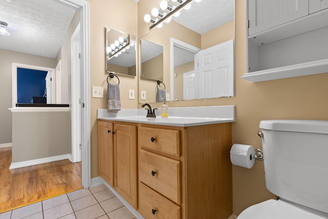 1271 Fareharm Dr, New Albany, OH 43054 - bathroom featuring a textured ceiling, vanity, and tile patterned flooring