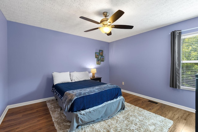 1271 Fareharm Dr, New Albany, OH 43054 - bedroom featuring wood finished floors, a textured ceiling, and ceiling fan