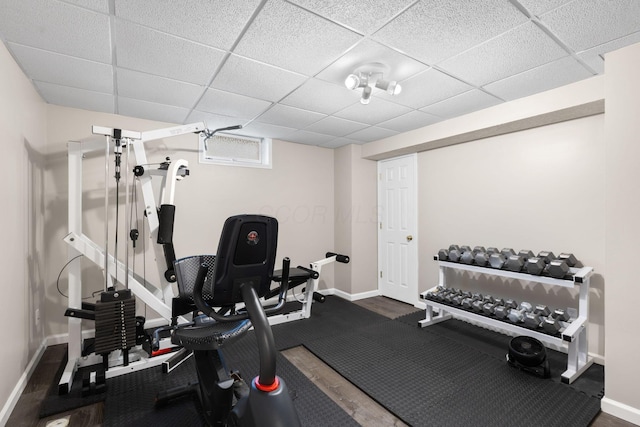1271 Fareharm Dr, New Albany, OH 43054 - workout room with baseboards and a paneled ceiling