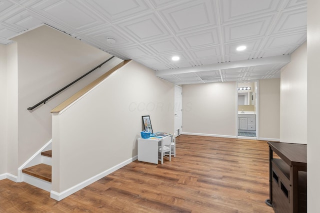 1271 Fareharm Dr, New Albany, OH 43054 - finished basement with recessed lighting, wood finished floors, stairway, and an ornate ceiling