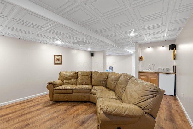 1271 Fareharm Dr, New Albany, OH 43054 - living room with wet bar, an ornate ceiling, light wood finished floors, and recessed lighting