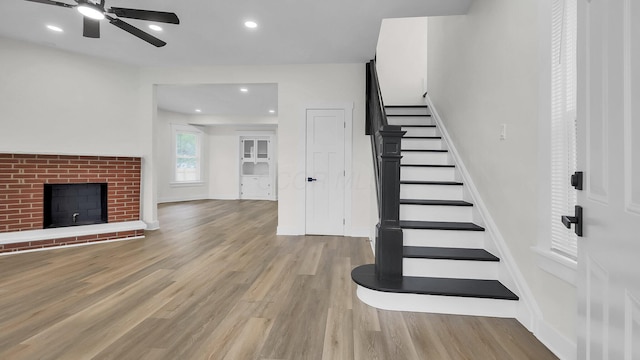 732 Columbus Ave, Washington Court House, OH 43160 - stairway featuring ceiling fan, wood finished floors, recessed lighting, and a brick fireplace
