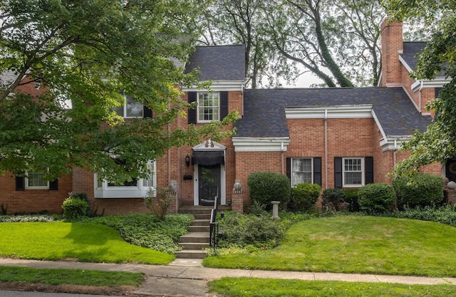409 N High St, Lancaster, OH 43130 - view of front of house with brick siding and a front lawn