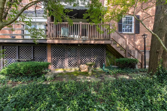 409 N High St, Lancaster, OH 43130 - back of house with brick siding, a wooden deck, and stairway