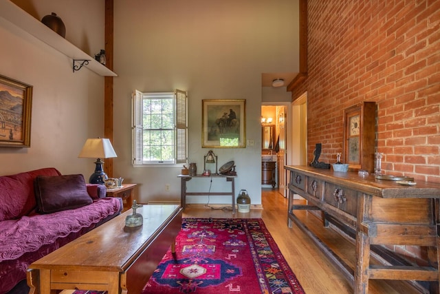 409 N High St, Lancaster, OH 43130 - living room with a towering ceiling and light wood-style flooring