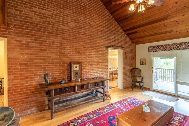 409 N High St, Lancaster, OH 43130 - living room featuring wooden ceiling, high vaulted ceiling, brick wall, and wood finished floors