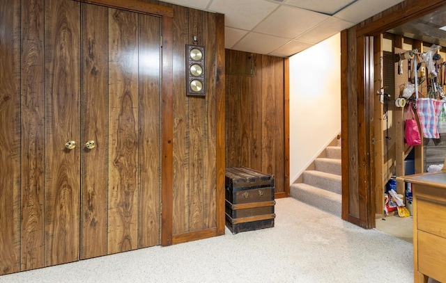 409 N High St, Lancaster, OH 43130 - finished basement featuring wood walls, stairs, carpet flooring, and a drop ceiling