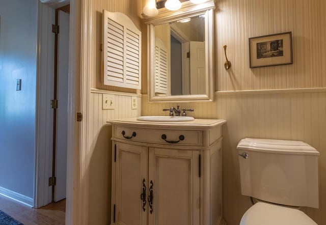 409 N High St, Lancaster, OH 43130 - half bathroom featuring vanity and wood finished floors