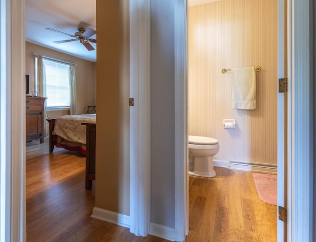 409 N High St, Lancaster, OH 43130 - bathroom featuring a baseboard heating unit, ceiling fan, and wood finished floors