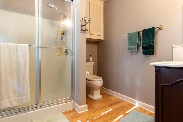 409 N High St, Lancaster, OH 43130 - full bath with wood finished floors, a shower stall, and vanity