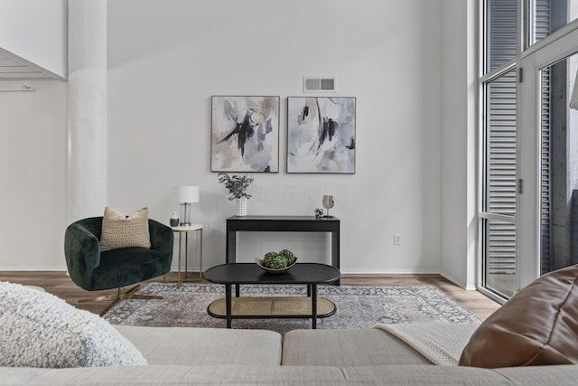 60 E Spring St Unit 220, Columbus, OH 43215 - living area featuring wood finished floors and baseboards