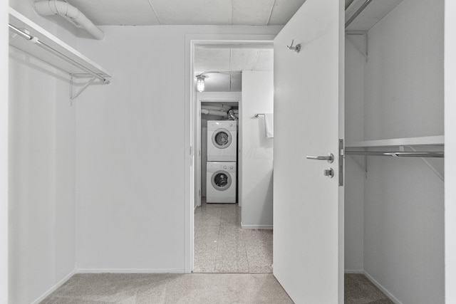 60 E Spring St Unit 220, Columbus, OH 43215 - spacious closet with stacked washer / dryer and carpet floors