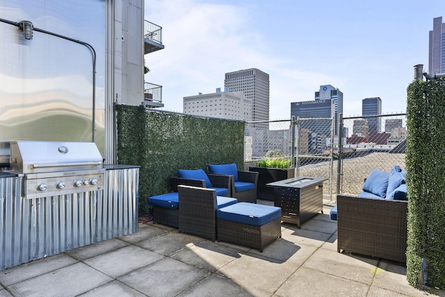 60 E Spring St Unit 220, Columbus, OH 43215 - view of patio / terrace with outdoor lounge area, area for grilling, and a city view