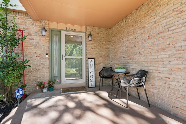 6666 Sharon Woods Blvd, Columbus, OH 43229 - doorway to property with brick siding and covered porch