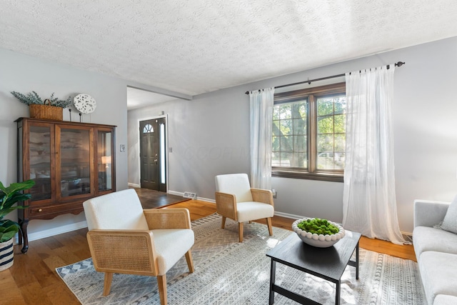 6666 Sharon Woods Blvd, Columbus, OH 43229 - living area featuring a textured ceiling and wood finished floors