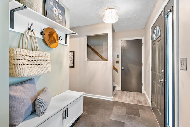 6666 Sharon Woods Blvd, Columbus, OH 43229 - mudroom with baseboards and a textured ceiling