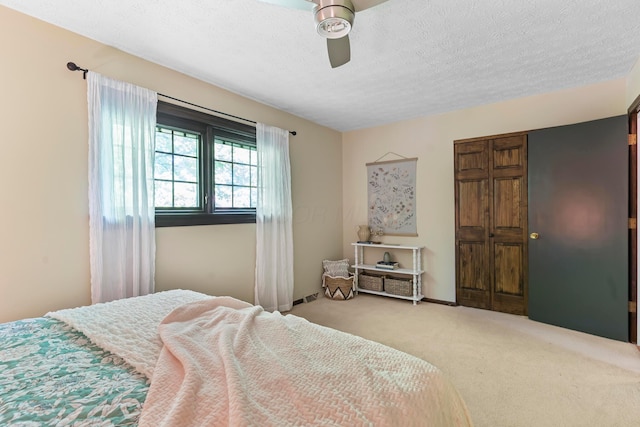 6666 Sharon Woods Blvd, Columbus, OH 43229 - bedroom with carpet floors, a textured ceiling, ceiling fan, and a closet