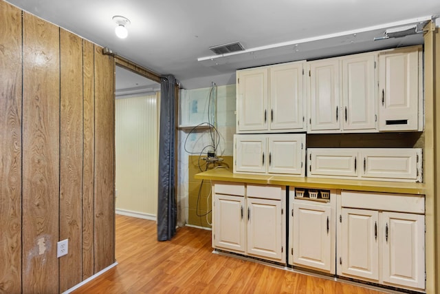 6666 Sharon Woods Blvd, Columbus, OH 43229 - kitchen featuring light wood-type flooring, white cabinets, and light countertops