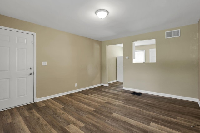 1077-1079 S James Rd, Columbus, OH 43227 - spare room featuring baseboards and dark wood-style floors