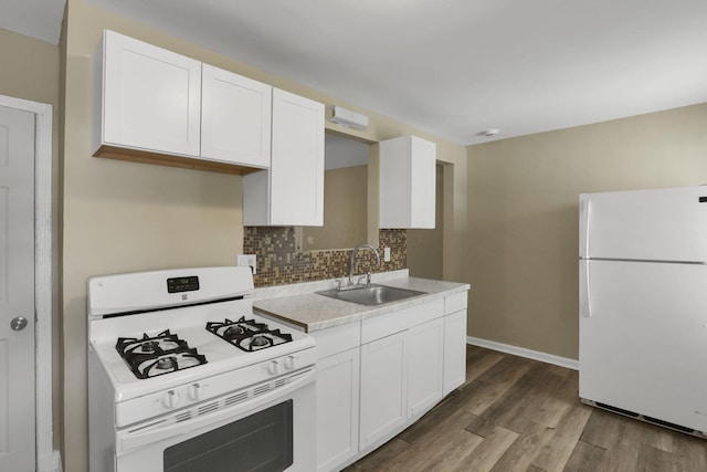 1077-1079 S James Rd, Columbus, OH 43227 - kitchen featuring white appliances, light countertops, dark wood-style flooring, white cabinetry, and backsplash