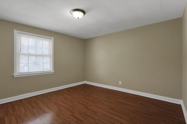 1077-1079 S James Rd, Columbus, OH 43227 - spare room with dark wood-style floors and baseboards