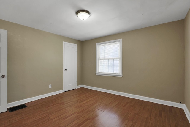 1077-1079 S James Rd, Columbus, OH 43227 - empty room featuring baseboards and wood finished floors