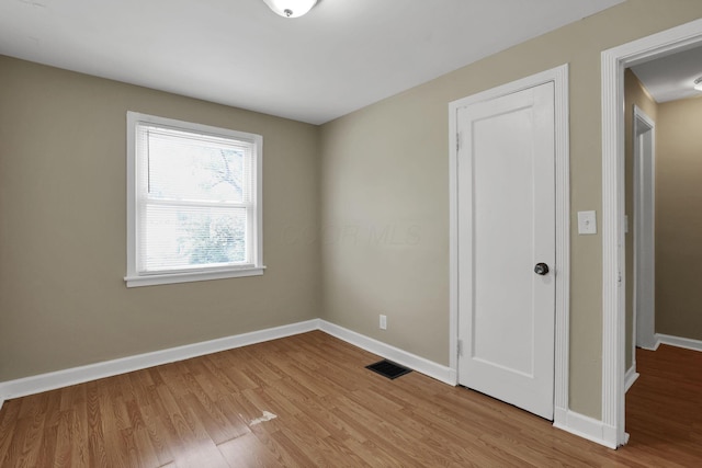 1077-1079 S James Rd, Columbus, OH 43227 - unfurnished bedroom featuring wood finished floors and baseboards
